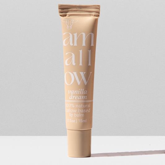 Vanilla Dream Lip balm tube shown. It reads Amallow Vanilla dream 100% natural tallow based lip balm .5 oz, 15ML