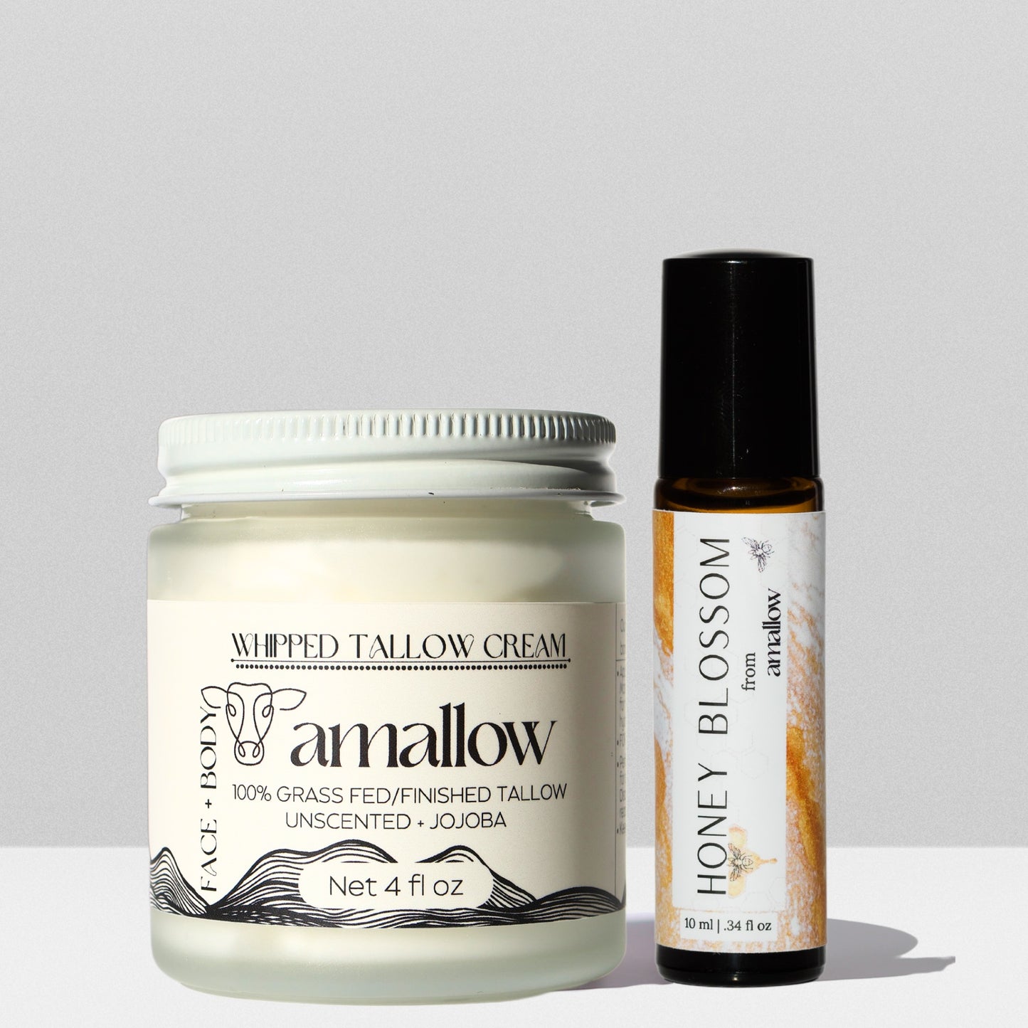 Unscented + Jojoba Oil Tallow Cream and Honey Blossom Perfume oil shown together.