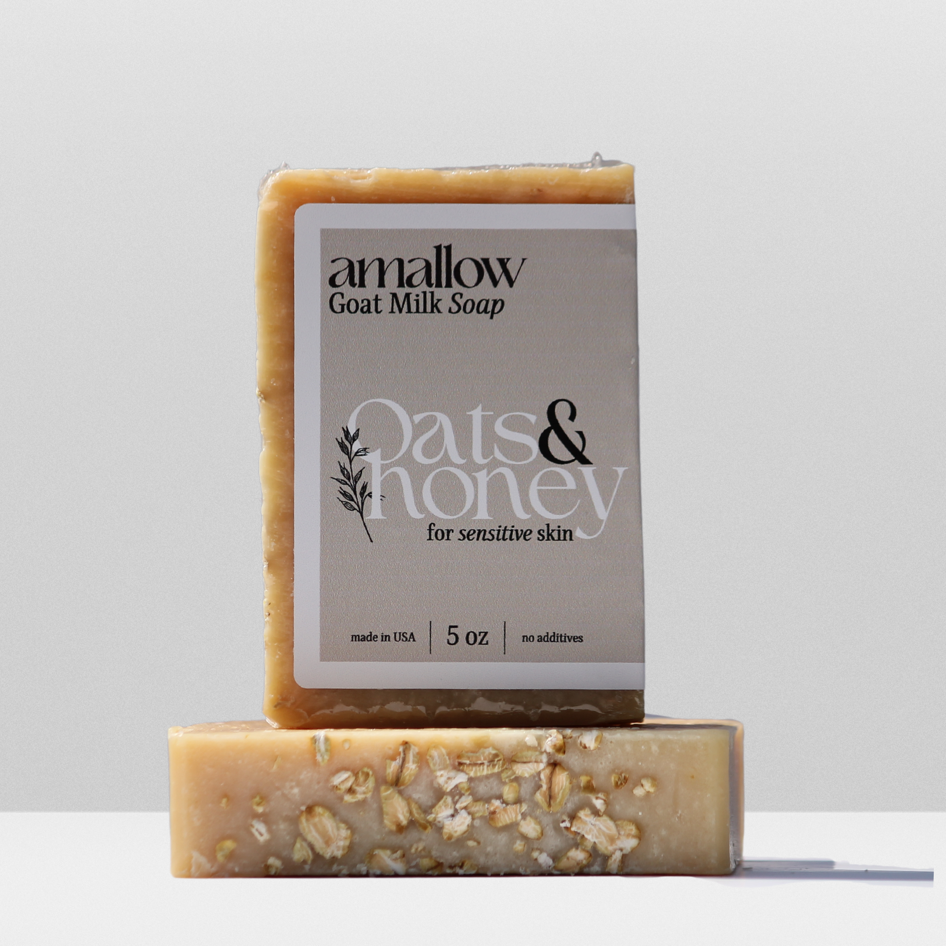 Oats & Honey soap shown. Label Reads "Amallow Goat Milk Soap. Oats & Honey for sensitive skin. Made in USA 5 oz, no additives.