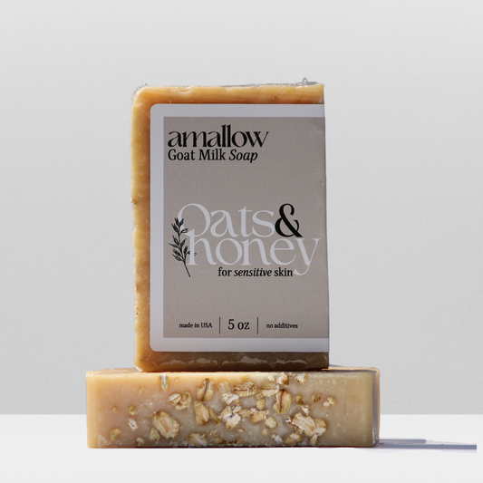 Oats & Honey soap shown. Label Reads "Amallow Goat Milk Soap. Oats & Honey for sensitive skin. Made in USA 5 oz, no additives.
