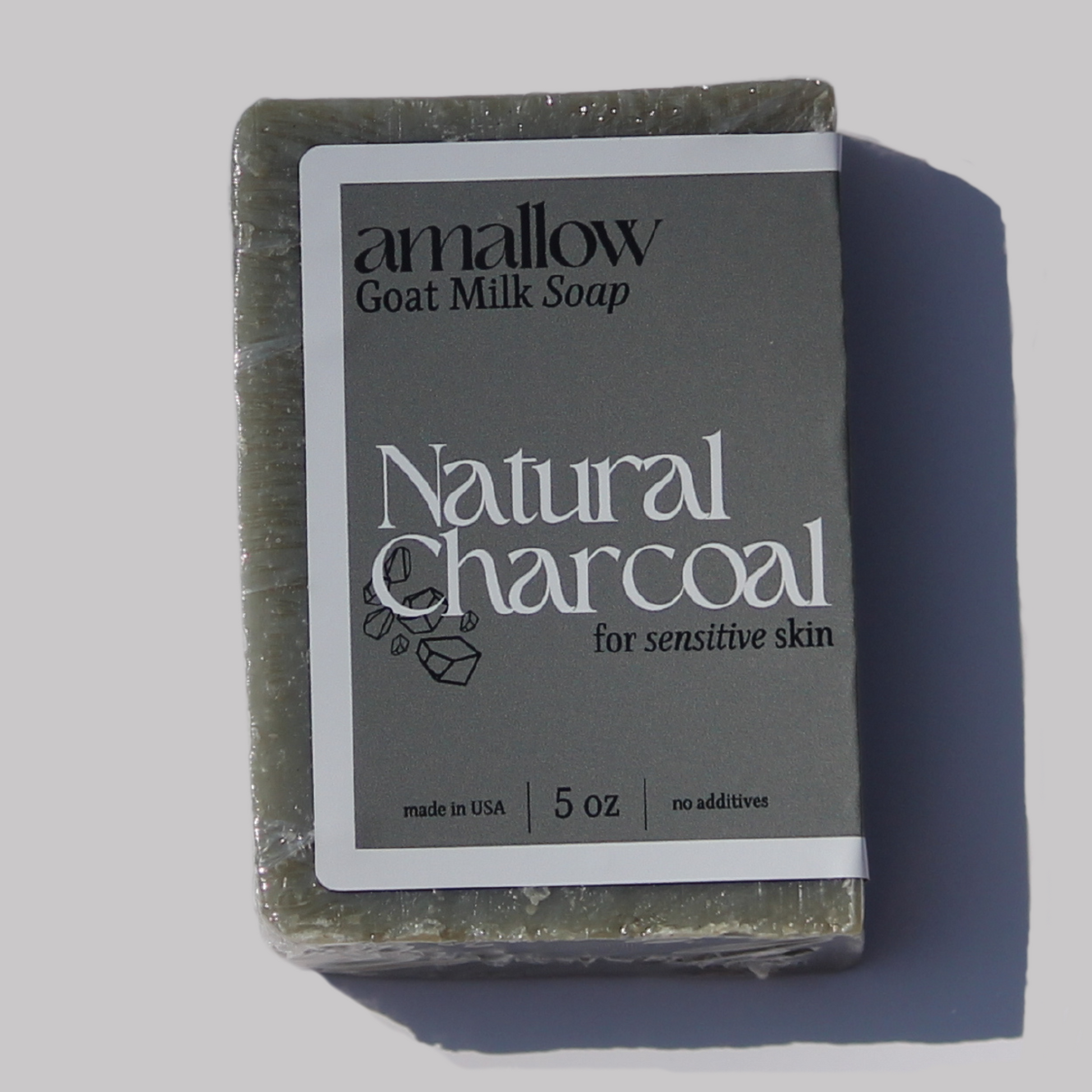 Natural Charcoal soap bar shown close up.