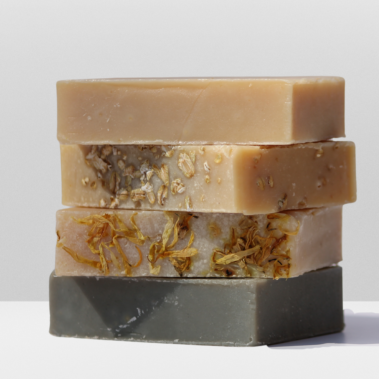 Picture showing all 4 variations of soap stacked on top of each other.