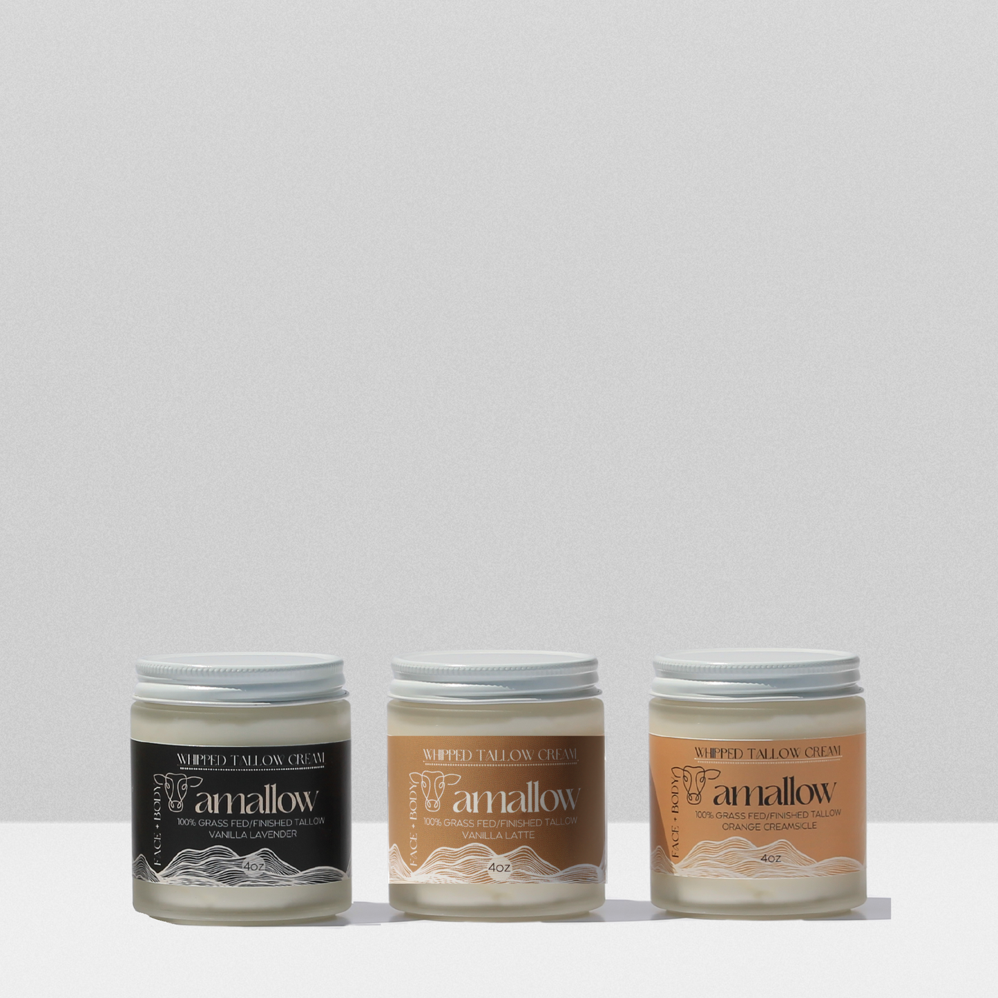 Trio of Vanilla Lavender, Vanilla Latte and Orange creamsicle products shown together.