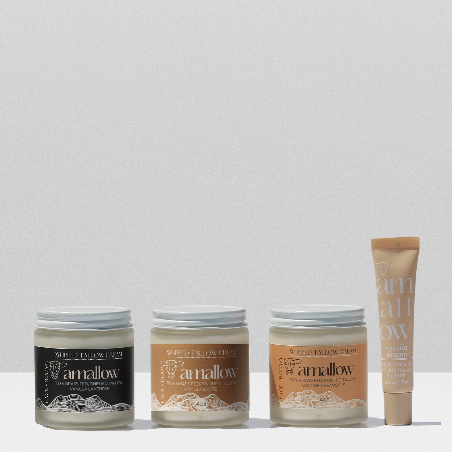 Bundle of Vanilla Lavender, Vanilla Latte and Orange Creamsicle shown together with vanilla dream lip balm.