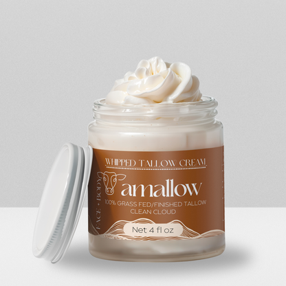 Clean Cloud product shown with cream coming out the top. Label is a rusty color. Whipped Tallow Cream  100% grass fed/finished. Net 4 Fluid Oz. Face + Body.