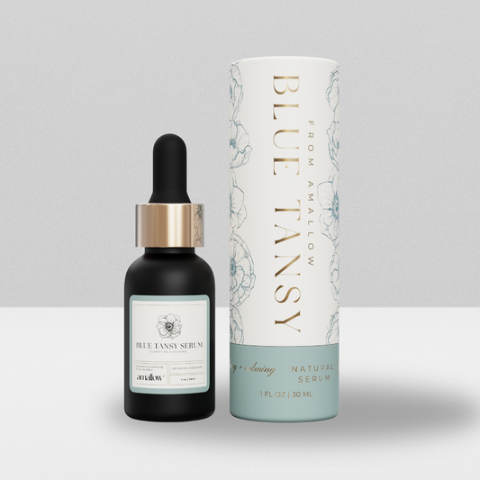 Bottle of Amallow blue tansy serum next to the product tube.