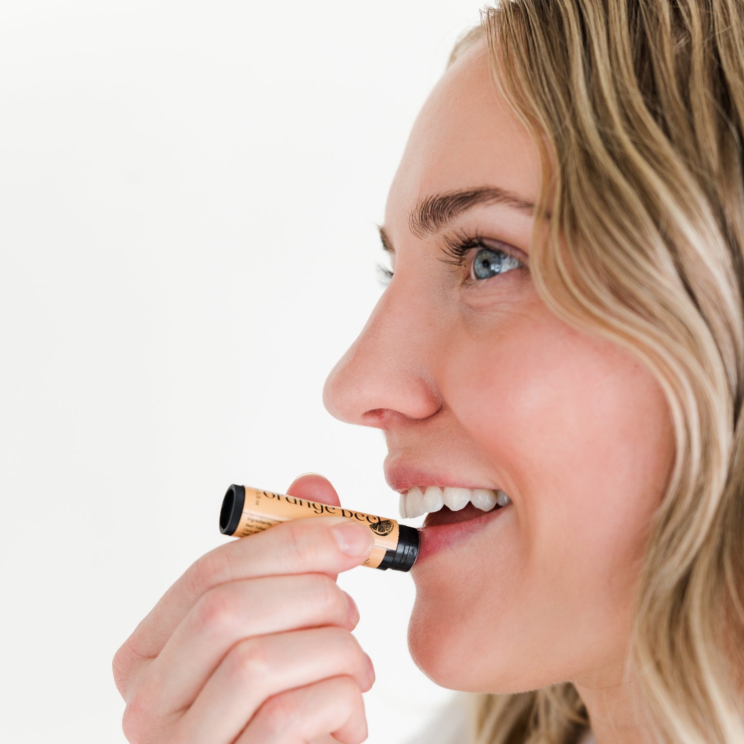 Woman Applying Amallow Lip Balm