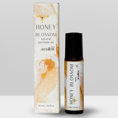 Honey Blossom Perfume Roller Pictured. Next to box. Box states Honey Blossom Natural Perfume oil from Amallow 10ML, .34 fluid oz. Roller says Honey blossom from amallow 10 ML .34 fluid ounces. 