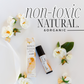 Photo of roller and box with flowers in background. Says non-toxic Natural & Organic. 